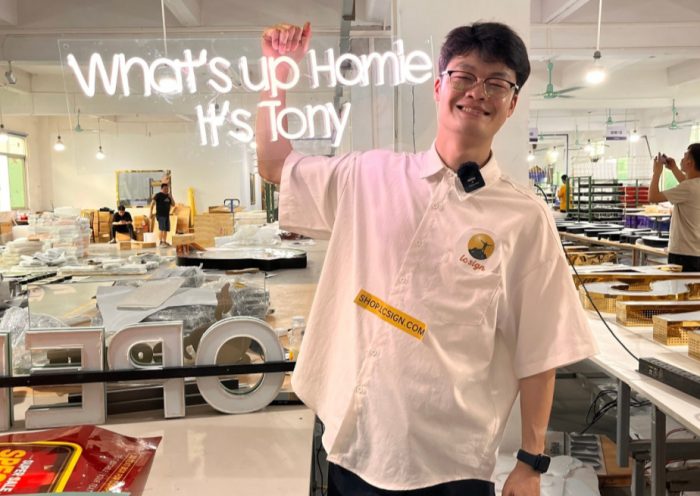 Tony from LC Sign showcasing LED signs with humor and accents